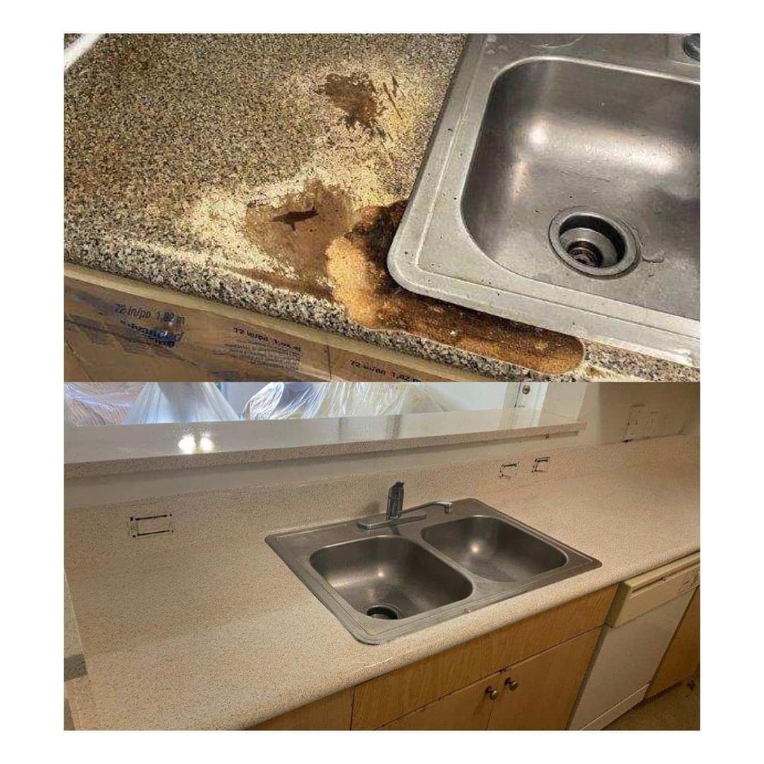 A sink and counter with some rust on it